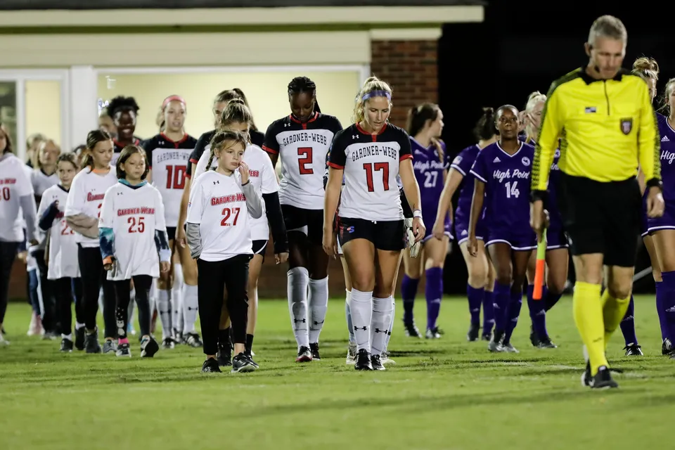 Competitive women's soccer action — Coach Anna Fish